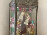 a statue of a woman and a man in a glass case
