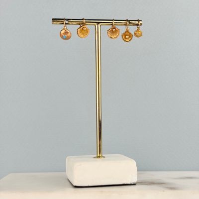 a close up of a lamp on a table with a marble base