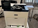 an image of a printer sitting on top of a stack of boxes