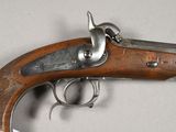 a close up of a gun that is on a table