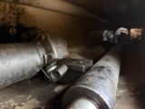 a close up of a couple of exhaust pipes on the ground