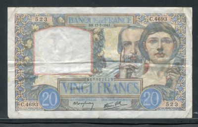un gros plan sur une feuille de papier sur laquelle figure la photo d'un homme et d'une femme