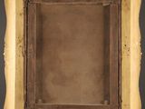 an old picture frame with a red wall in the background
