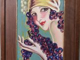 une peinture à l'huile représentant une femme avec des raisins dans les cheveux