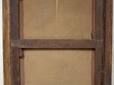 an old picture frame hanging on a wall with a string
