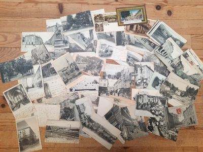 many old black and white photos of a bunch of buildings on a table
