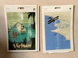 two luggage tags on a table with a picture of a plane