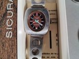 a watch that is in a box on a table