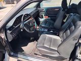 a picture of the inside of a car with the door open