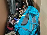 a large blue backpack sitting inside of a cardboard box