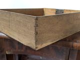 a wooden box sitting on top of a wooden table