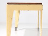 an image of a yellow stool with a wooden seat on a white surface