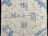 a close up of a blue and white handkerchief on a black background