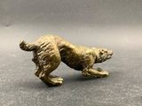 gold dog figurine on a gray background