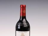 a bottle of wine that is sitting on a table