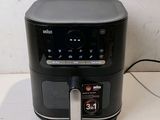 an image of an air fryer sitting on a counter