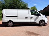 a white van that is parked in a parking lot