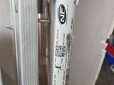 a close up of a metal door handle with a sticker on it