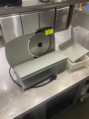 1 trancheuse à jambon électrique
