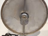 a metal fan that is sitting on a table