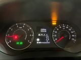 a close up of the dashboard of a car with the lights on