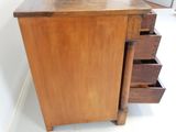 an image of a wooden dresser with drawers in a room