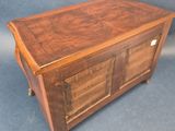 an image of a wooden chest sitting on top of a blue background