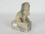 an image of a statue of a lion sitting on a box