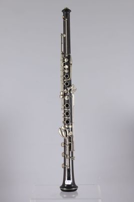a close up of a clarinet on a clear surface