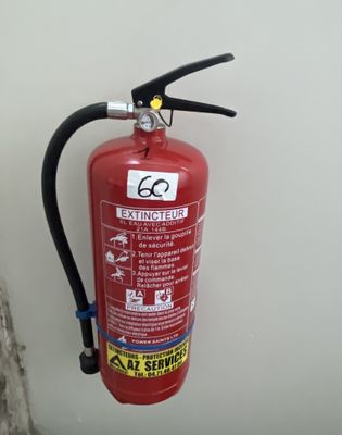 a fire extinguisor attached to a wall