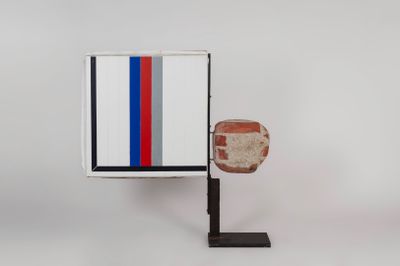 an image of a red, white, and blue object on a black stand