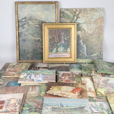 a lot of paintings and paintings on the table