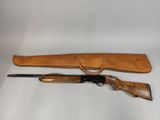 two shotguns and a gun on a white background