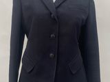 the jacket is black and has buttons on the front