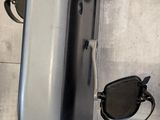 a pair of sunglasses sitting on top of an exercise machine