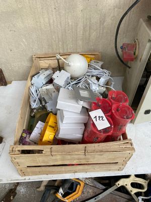a wooden box filled with assorted items on a table