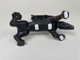 an antique cast iron dog figurine with tags on it ' s back