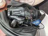 a black camera in a black bag on a table