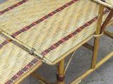 a wicker chair that is sitting on the ground