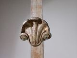 a wooden pole with a decorative design on it