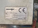 a sign on the side of a machine that says serrmac