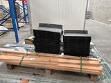 several stacks of wood sit on a pallet in a warehouse