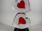 a glass sculpture of two hearts on top of each other