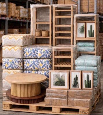 a stack of boxes with pictures on them in a warehouse