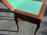 a small table with a book on top of it