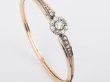 an image of a gold and diamond bang bracelet