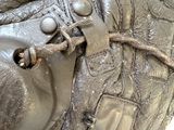 a close up of a purse with a chain on it