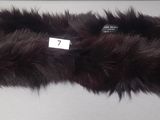 a brown fur headband with a tag on it