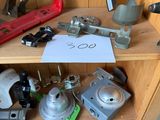 many different tools on a wooden shelf in a room