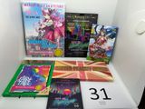 a lot of books that are on a shelf